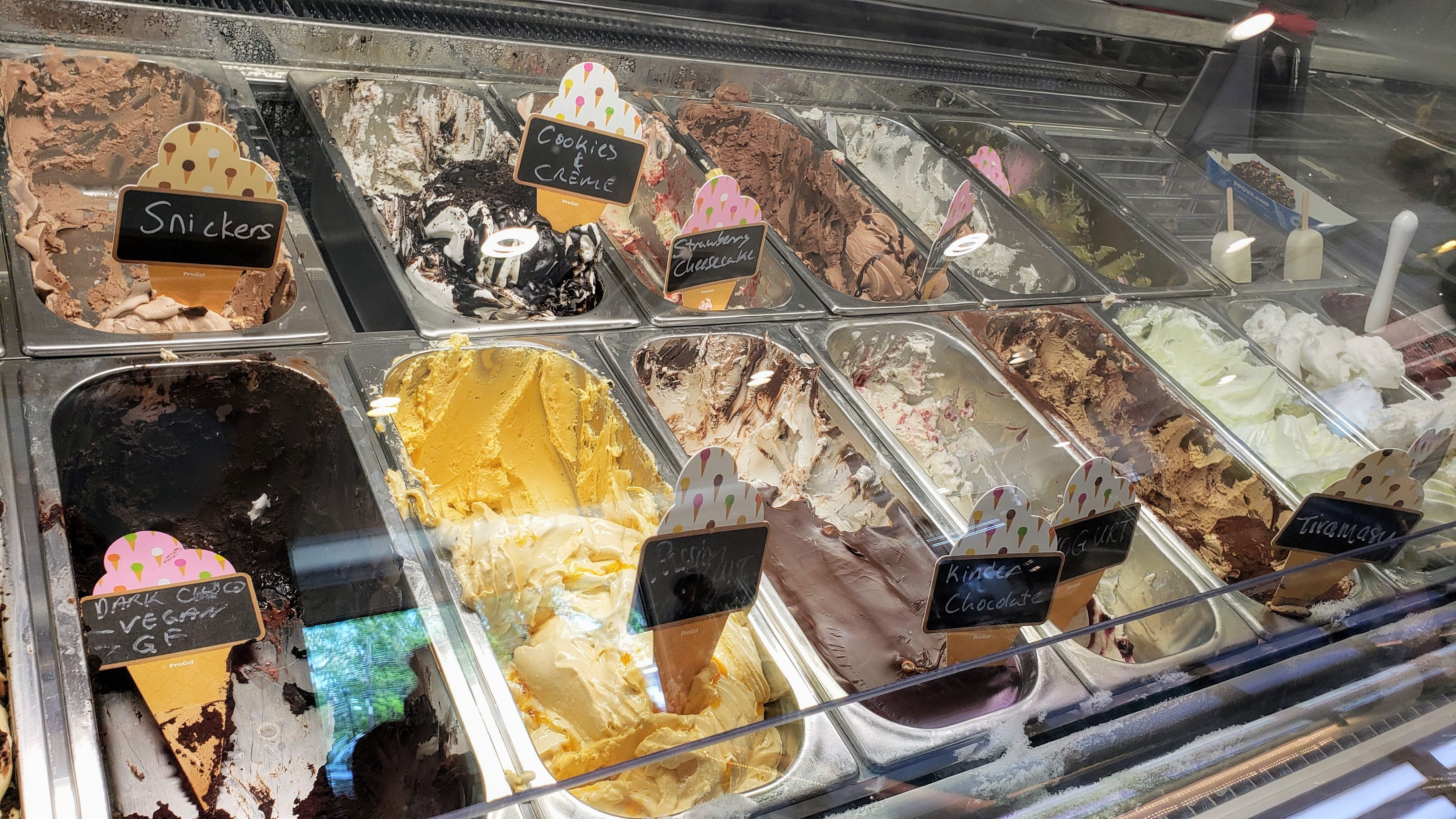 Gelato case showing Snickers, Cookie Creme and other flavors