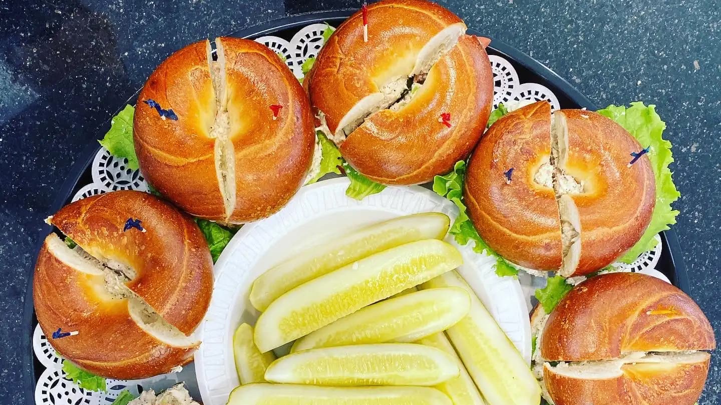Bagel sandwich platter with pickles, ideal for catering
